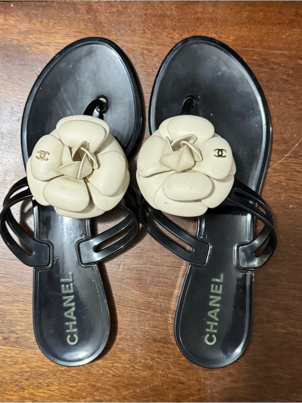 CHANEL Black Jelly Sandals with Cream Camellia Accents